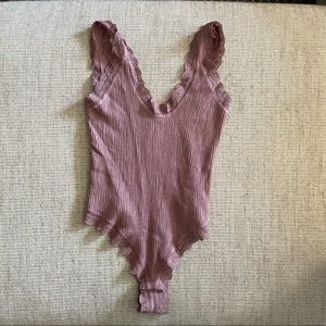 Out from under body suit